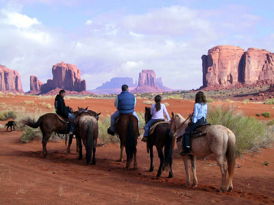 Photo of horseback riders in Monument Valley Navajo Nation Park